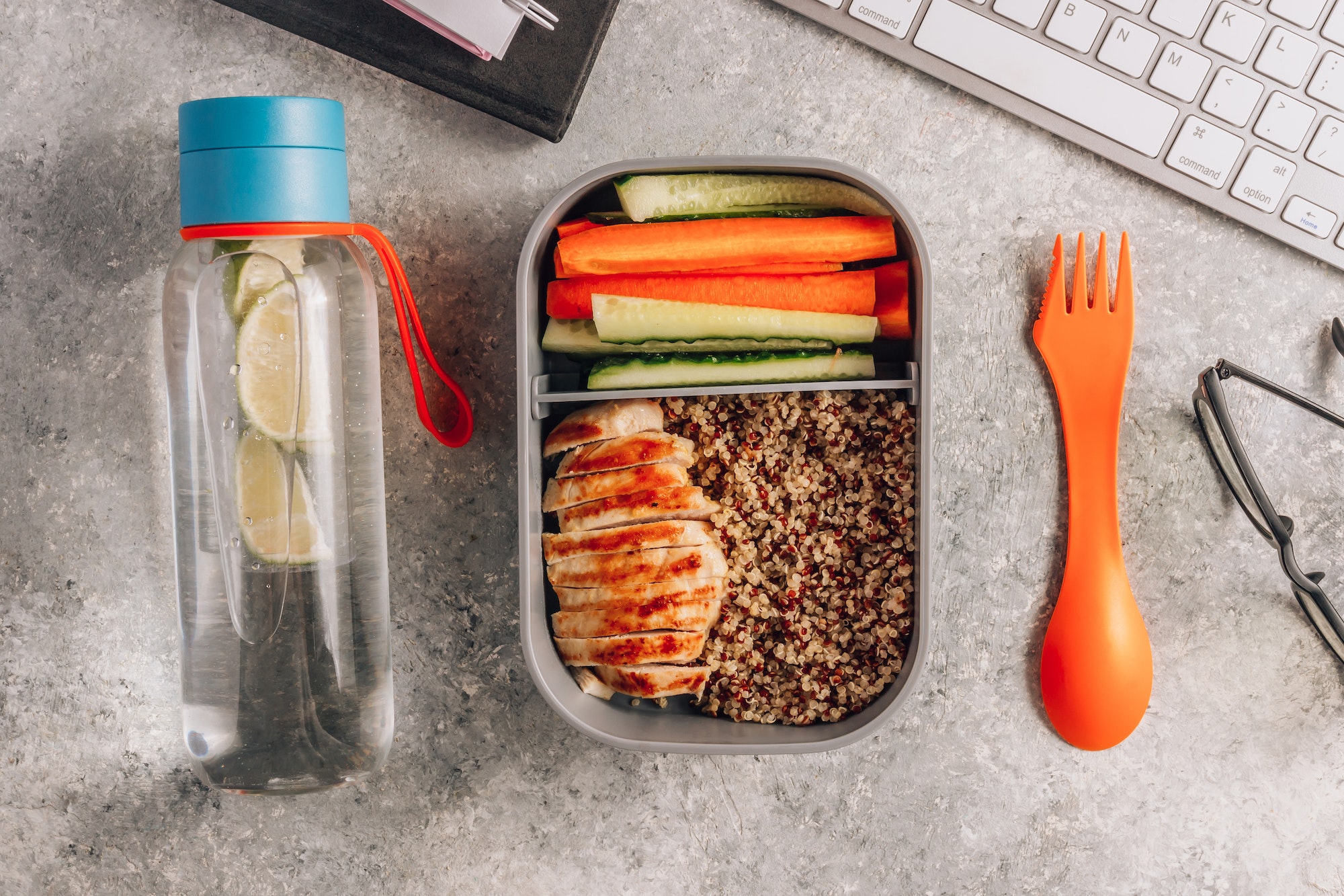 Healthy meal prep containers with quinoa,